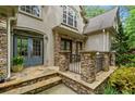 Inviting front porch and stone accents at 8170 Hurakan Creek Xing, Cumming, GA 30028