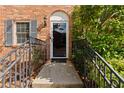 Inviting entryway with black metal railing leading to front door at 111 Northdale Pl, Lawrenceville, GA 30046