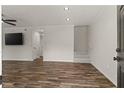 Bright living room featuring stylish flooring, modern ceiling fan, and neutral paint at 111 Northdale Pl, Lawrenceville, GA 30046