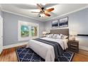 Well-lit bedroom showcasing hardwood floors, ceiling fan, and neutral tones at 960 Taft Ne Ave # 9, Atlanta, GA 30309