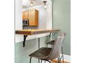Eat-in dining area featuring breakfast bar and seating, with view into the kitchen at 960 Taft Ne Ave # 9, Atlanta, GA 30309