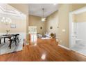 Spacious living room with tall ceilings, hardwood floors, open layout, and seamless transition to dining and bath at 3219 Abbott Dr # 5, Powder Springs, GA 30127