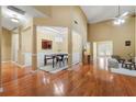 Elegant living room boasts tall ceilings, hardwood floors, natural light, and views into the kitchen at 3219 Abbott Dr # 5, Powder Springs, GA 30127