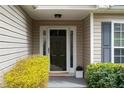 A close-up of the front door with surrounding landscaping, providing curb appeal at 4219 David Austin Ct, Snellville, GA 30039