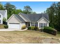 Charming single-Gathering home featuring a two-car garage and well-maintained landscaping at 4219 David Austin Ct, Snellville, GA 30039