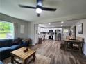 Bright, open-concept layout with comfortable seating, dining area, and a modern kitchen with stainless steel appliances at 6567 Post Rd, Douglasville, GA 30135
