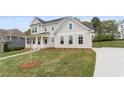Attractive exterior with well-kept lawn, long driveway and Craftsman-style architecture at 4060 Andover Cir, Mcdonough, GA 30252
