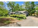 Image of a well-maintained home with charming details and a lush, green lawn at 3770 Clubland Trl, Marietta, GA 30068