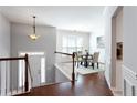 Dining area with a pendant light, hardwood floors, wainscotting, and modern decor at 4766 Longcourt Se Dr # 23, Atlanta, GA 30339
