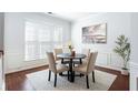 Bright dining area featuring stylish furnishings and a large window with natural light at 4766 Longcourt Se Dr # 23, Atlanta, GA 30339
