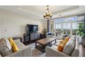 Inviting living room features a large window, balcony, and comfortable seating at 2700 Paces Ferry Se Rd # 202, Atlanta, GA 30339