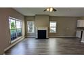 Bright living room with new hard surface flooring and decorative fireplace at 3142 Imperial Sw Cir, Atlanta, GA 30311