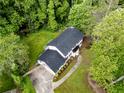 Aerial view of a meticulously maintained property with lush landscaping and mature trees at 5380 Northchester Ct, Dunwoody, GA 30338