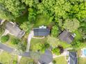 Beautiful aerial view of the property showcasing its mature trees, landscaping, and neighborhood at 5380 Northchester Ct, Dunwoody, GA 30338