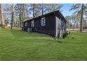 Expansive backyard showcasing lush green grass and the home's exterior at 1722 San Gabriel Ave, Decatur, GA 30032