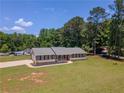 Well-maintained ranch-style home with a charming front porch, new roof, and driveway at 70 Heritage Way, Covington, GA 30016