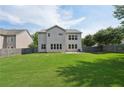 Large, flat backyard enclosed by a dark wood fence, with plenty of space for outdoor activities at 251 Parc Dr, Canton, GA 30114