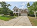 Charming two-story home featuring a double-decker porch, well-maintained lawn, and inviting curb appeal at 251 Parc Dr, Canton, GA 30114
