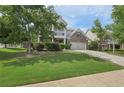 Charming two-story home featuring a double-decker porch, well-maintained lawn, and inviting curb appeal at 251 Parc Dr, Canton, GA 30114