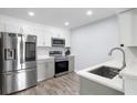 Well-lit kitchen with stainless steel appliances, light gray cabinets, and a modern faucet at 2657 Lenox Ne Rd # A-5, Atlanta, GA 30324