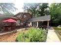 Spacious backyard features a patio, a hot tub, and a relaxing space for outdoor enjoyment at 1652 Weymouth Ct, Tucker, GA 30084