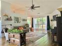 Bright living room featuring high ceilings, hardwood floors, and large windows offering plenty of natural light at 2945 Dogwood Creek Parkway, Duluth, GA 30096