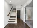 Inviting foyer with hardwood floors, staircase and easy access to rooms on the main floor at 808 Angora Aly, Scottdale, GA 30079