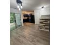 Modern eat-in kitchen boasts stainless appliances, granite countertops, and a sliding glass door at 1700 Devon Sw Dr, Atlanta, GA 30311