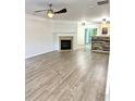 Bright open-concept living room with fireplace and hardwood flooring at 1700 Devon Sw Dr, Atlanta, GA 30311