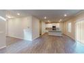 Spacious living room with hardwood floors and lots of natural light through sliding glass door at 3 Roving Hills Cir, Cartersville, GA 30121