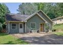 Charming single-Gathering home featuring a well-maintained lawn and ample parking space at 1650 Tomahawk Trl, Cumming, GA 30041