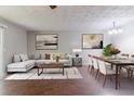 Open-concept living and dining areas with stylish furnishings and modern decor that create a welcoming atmosphere at 5509 Covent Way, Lithonia, GA 30058