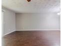 Spacious living room featuring hardwood floors and neutral walls at 5509 Covent Way, Lithonia, GA 30058