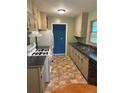 Functional kitchen with ample cabinet space, laminate countertops, and a gas range at 1234 Carolyn St, Marietta, GA 30062