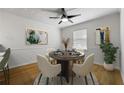 Cozy dining room with modern ceiling fan, hardwood floors, and neutral decor at 1622 Executive Park Ne Ln, Atlanta, GA 30329