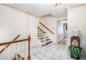 Elegant foyer with marble tile flooring, a staircase with white railings, and decorative accents at 2855 Cedar Canyon Ct, Atlanta, GA 30345