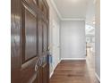 Inviting foyer featuring wood floors and fresh, neutral paint at 607 Tall Timbers, Woodstock, GA 30188