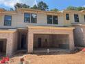 New townhouse construction showing brick facade and two-car garage at 1406 Lucan Nw Ln # Wc221, Lawrenceville, GA 30043