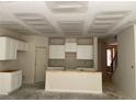 Unfinished kitchen displays white cabinets and a breakfast bar at 1406 Lucan Nw Ln # Wc221, Lawrenceville, GA 30043