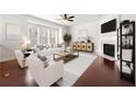 Bright living room boasts a fireplace, neutral palette, and large windows at 2513 Friar Tuck Se Ln # 1, Atlanta, GA 30339