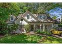 Attractive home with a well-maintained front yard and classic car parked on the side at 2517 Birchwood Ne Dr, Atlanta, GA 30305