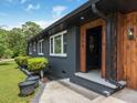The front door has wood trim and a window on the door with the street address on the side of the door at 3779 Elkridge Dr, Decatur, GA 30032