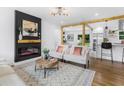 Sunlit living room showcasing modern fireplace, stylish decor and an open concept design at 3779 Elkridge Dr, Decatur, GA 30032