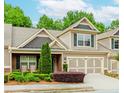 Inviting home with an attached two-car garage and meticulously maintained landscaping at 1555 Water Vista Ct # 4102, Cumming, GA 30041