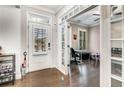 Inviting foyer with hardwood floors, French doors to an office, and a view of the front door with sidelights at 4831 Miller Hill Rd, Buford, GA 30518