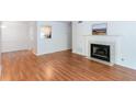 Bright open living room with fireplace and hardwood floors at 307 Berkeley Woods Dr, Duluth, GA 30096