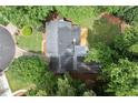 An aerial view of the home's roof, mature trees, and surrounding green landscape at 4504 Reva Ne Way, Marietta, GA 30066
