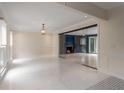 Bright living room with marble floors, glass-enclosed fireplace, and ample natural light at 2912 Vinings Forest Se Way, Atlanta, GA 30339