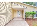 Close-up of home's entrance featuring a white door and complementary trim at 6350 Mozart Dr, Riverdale, GA 30296