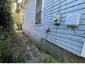 Shows a side view of the home's exterior with weathered siding at 158 Milton Sw Ave, Atlanta, GA 30314